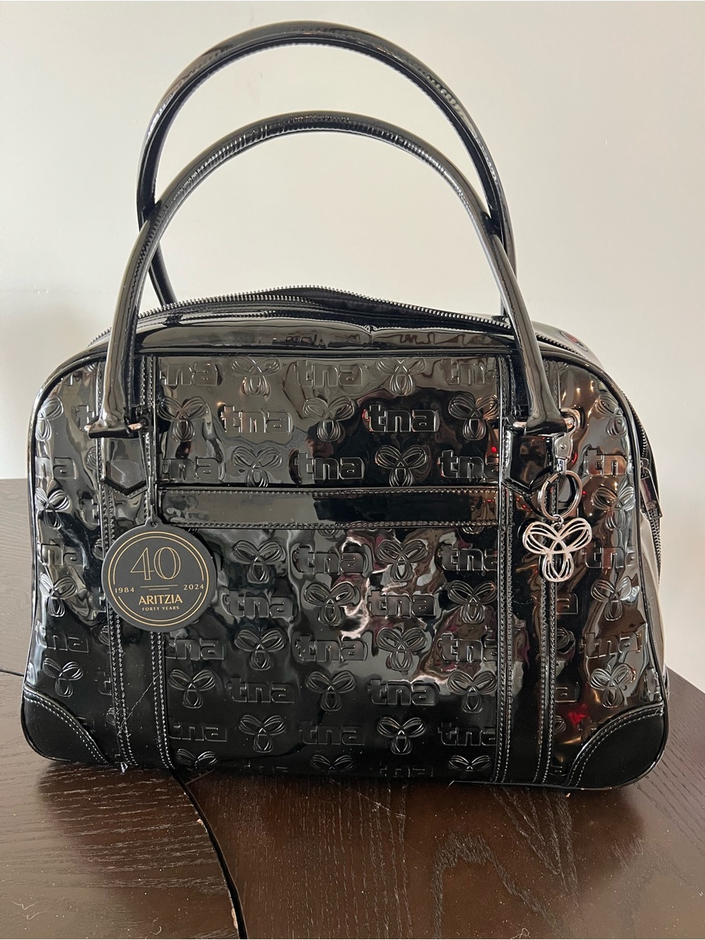 Aritzia Black Patent Satchel with Logo Embossing and Charm